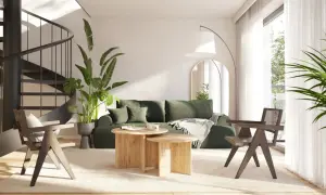Nowoczesny salon z zieloną sofą i drewnianymi meblami. Idealne miejsce na wakacyjny **wynajem apartamentów nad morzem**.